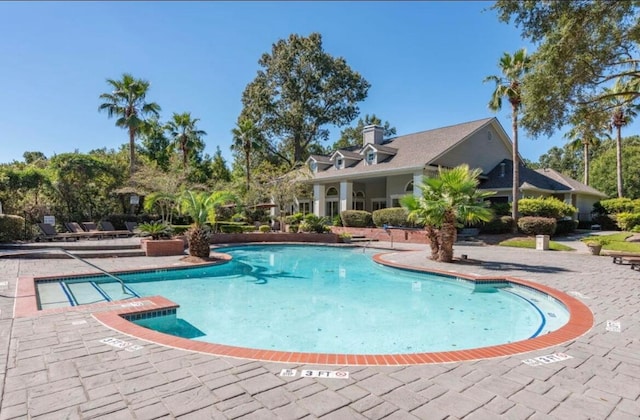 view of swimming pool featuring a patio