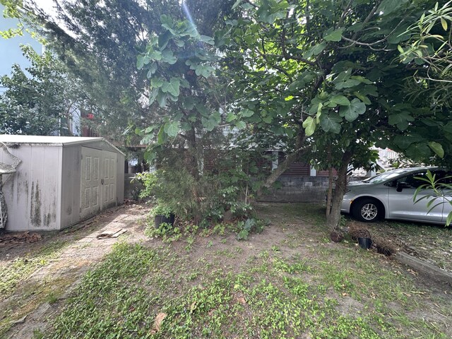 227 Fishburne St, Charleston, SC 29403 - view of yard featuring a storage shed and an outbuilding