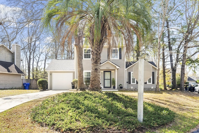 view of front facade featuring a garage, concrete driveway, and fence