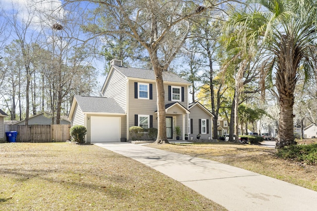 colonial inspired home with a garage, fence, concrete driveway, roof with shingles, and a chimney