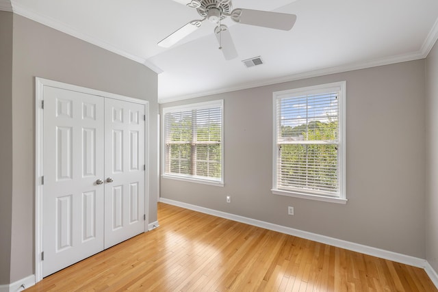 167 Palm Cove Way, Mount Pleasant, SC 29466 - unfurnished bedroom featuring crown molding, light wood-style floors, a closet, and a ceiling fan