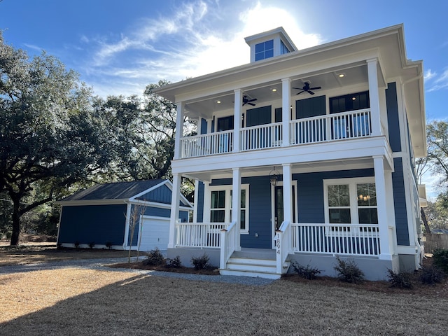 view of front of home with a ceiling fan, covered porch, an outdoor structure, and a balcony