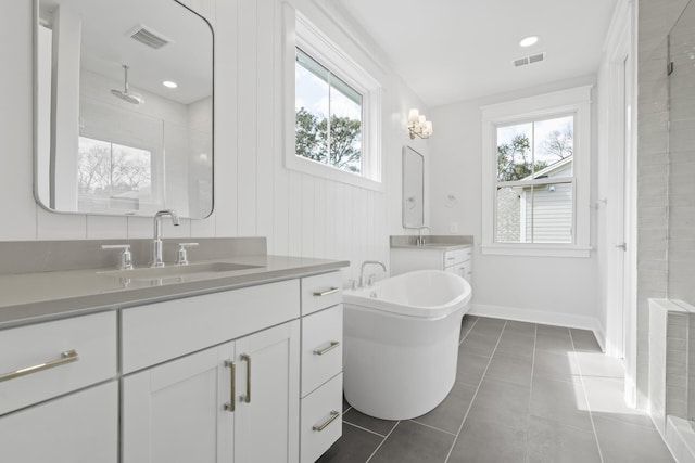 full bath with plenty of natural light, a sink, and visible vents