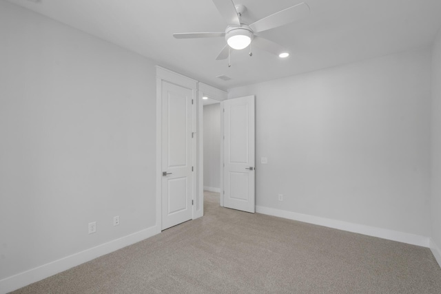 carpeted empty room featuring a ceiling fan, recessed lighting, and baseboards