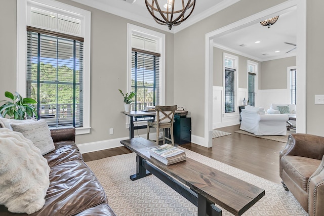 2072 Amenity Park Dr, Mount Pleasant, SC 29466 - living area with crown molding, a chandelier, plenty of natural light, dark wood-style floors, and baseboards
