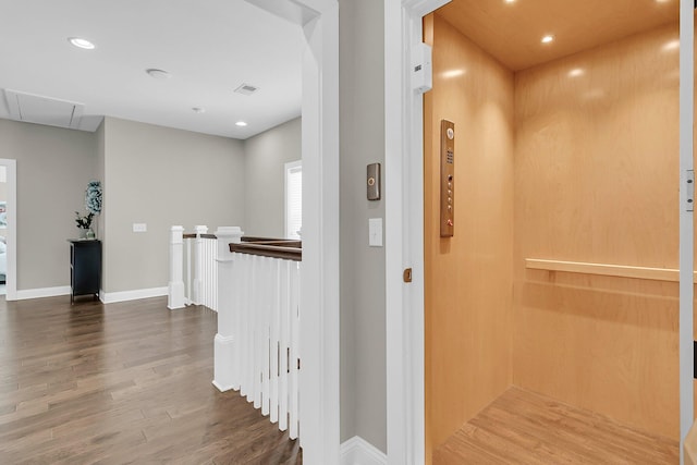 2072 Amenity Park Dr, Mount Pleasant, SC 29466 - hall with elevator, an upstairs landing, attic access, wood finished floors, and baseboards