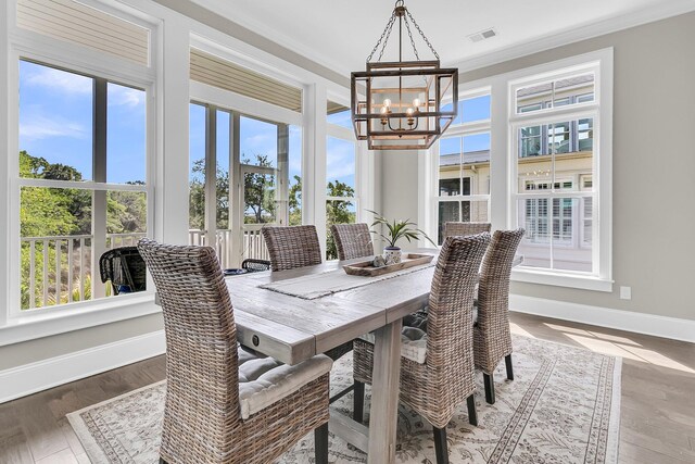 2072 Amenity Park Dr, Mount Pleasant, SC 29466 - dining space with healthy amount of natural light, a chandelier, baseboards, and ornamental molding