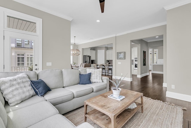 2072 Amenity Park Dr, Mount Pleasant, SC 29466 - living room featuring a chandelier, dark wood-type flooring, baseboards, ornamental molding, and recessed lighting