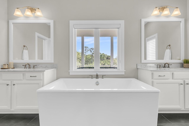 2072 Amenity Park Dr, Mount Pleasant, SC 29466 - bathroom featuring tile patterned flooring, a freestanding bath, and two vanities