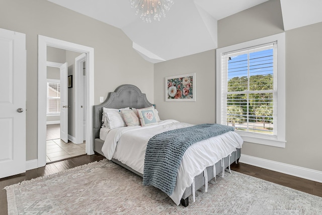 2072 Amenity Park Dr, Mount Pleasant, SC 29466 - bedroom featuring baseboards, a chandelier, wood finished floors, and lofted ceiling