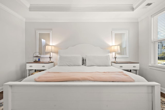 bedroom featuring hardwood / wood-style flooring and ornamental molding