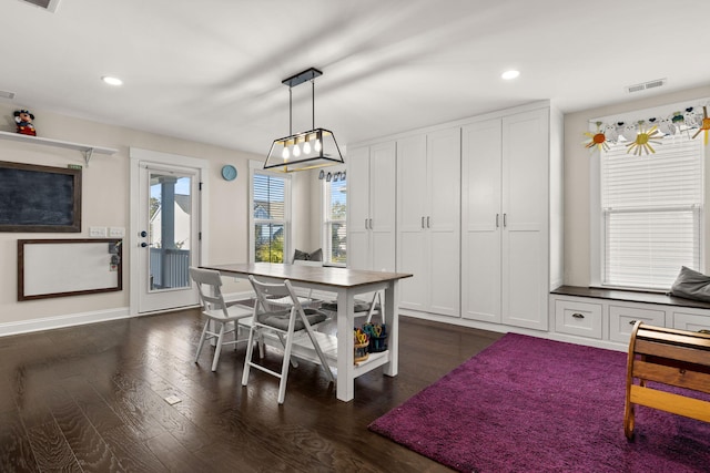 dining room featuring french doors and dark wood-type flooring