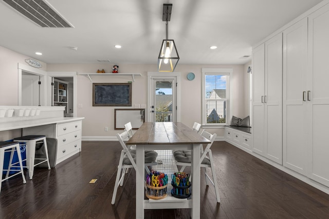 dining room with dark hardwood / wood-style floors