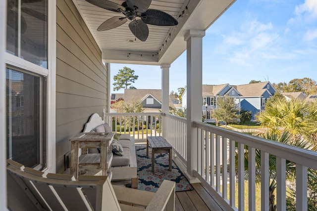 wooden deck featuring ceiling fan