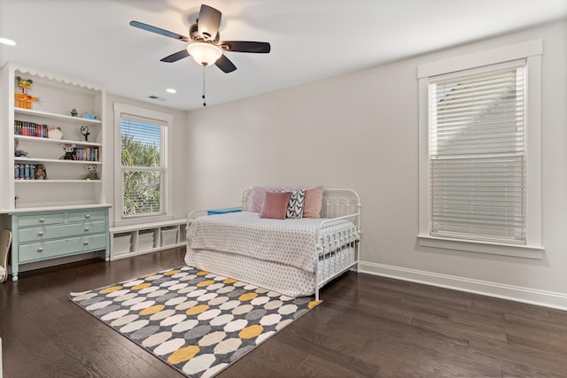 bedroom featuring dark hardwood / wood-style flooring and ceiling fan