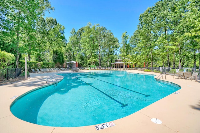 view of swimming pool featuring a patio area