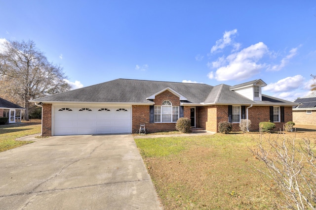 ranch-style house with a front yard and a garage