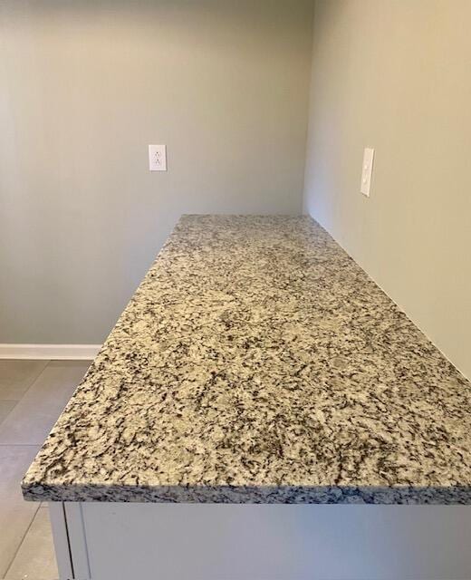 interior details featuring light stone countertops