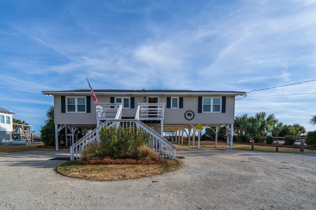 view of front of home featuring a carport and a porch