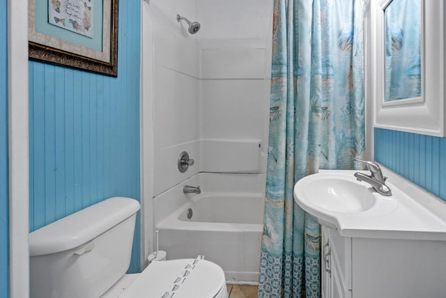 full bathroom featuring vanity, shower / bath combo, and toilet