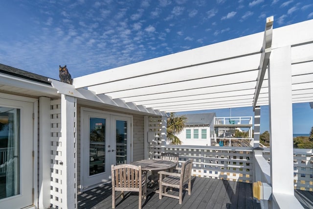 wooden deck with french doors and a pergola