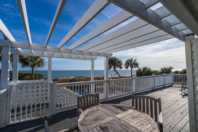 wooden deck with a pergola and a water view