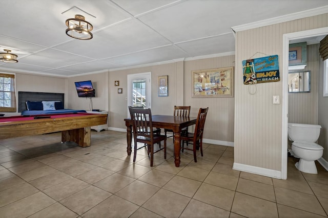 dining room with crown molding, light tile patterned floors, and pool table