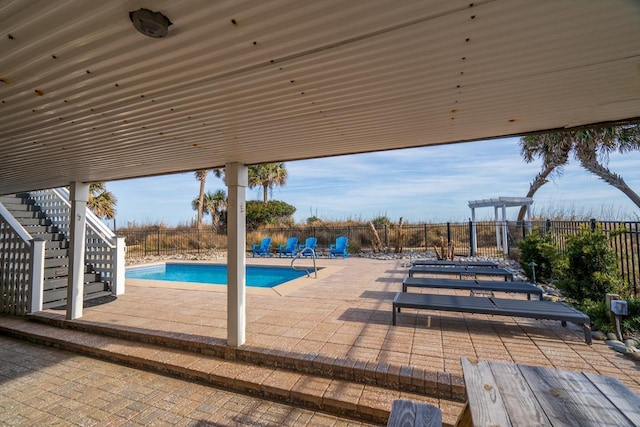 view of pool with a pergola and a patio