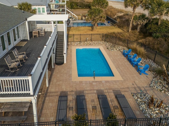 view of swimming pool with a patio, a deck, and a pergola