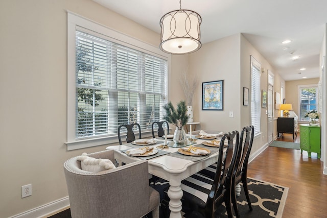 dining area with hardwood / wood-style floors