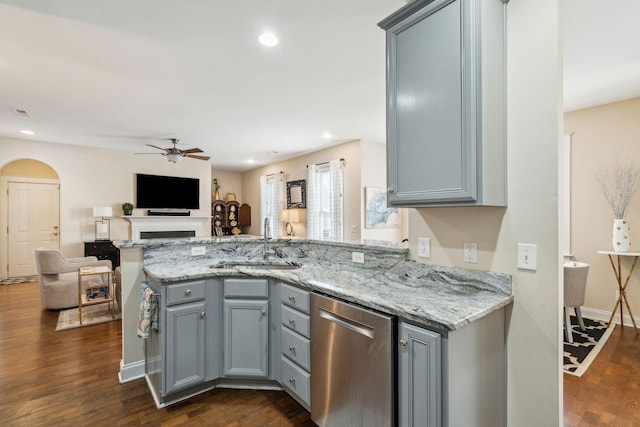 kitchen featuring gray cabinets, dark hardwood / wood-style floors, sink, stainless steel dishwasher, and kitchen peninsula