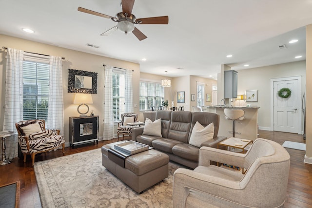 living room with ceiling fan and wood-type flooring