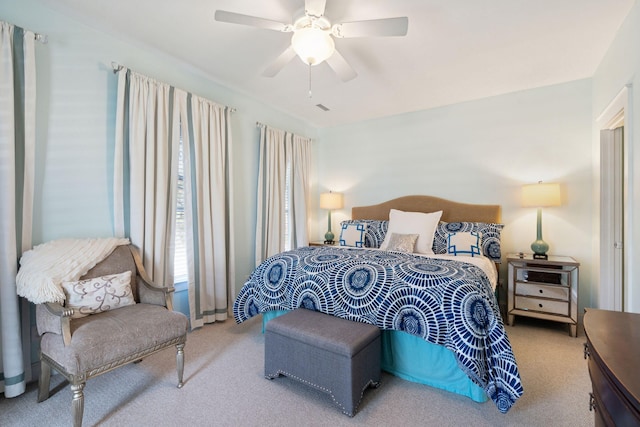 carpeted bedroom featuring ceiling fan