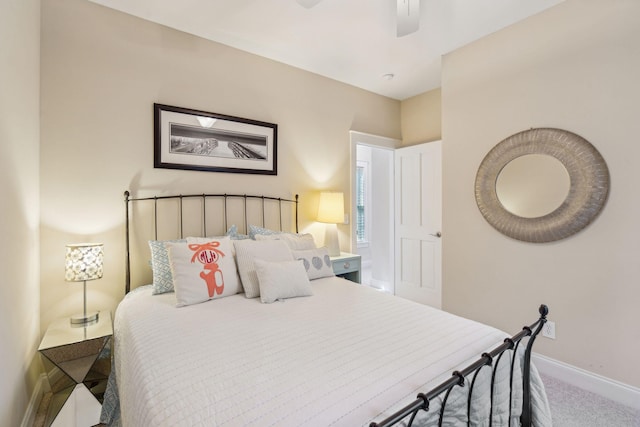 bedroom with ceiling fan and carpet flooring