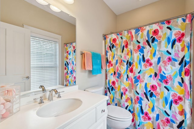 bathroom with vanity, toilet, and a shower with shower curtain