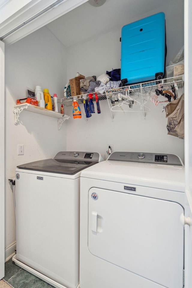 clothes washing area with washing machine and dryer