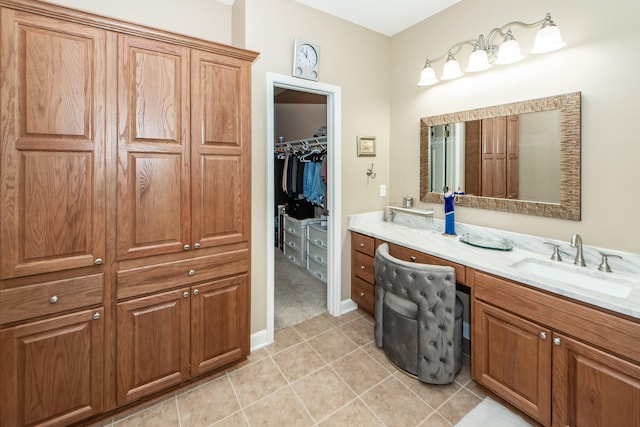 bathroom with tile patterned floors and vanity