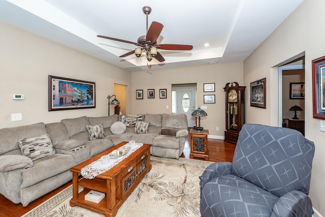 living room with hardwood / wood-style floors and ceiling fan