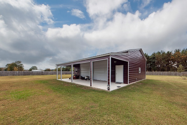 view of outbuilding with a lawn