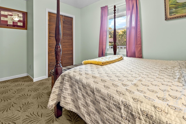 bedroom with baseboards, a closet, and carpet