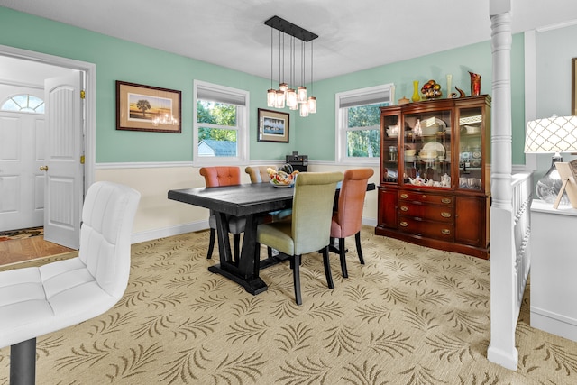 dining area with an inviting chandelier