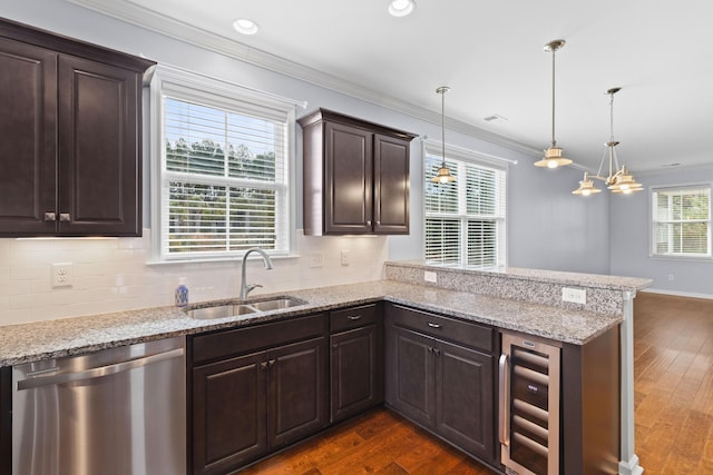 kitchen with dark wood-type flooring, wine cooler, dishwasher, and a sink