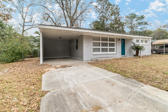 ranch-style house with a carport