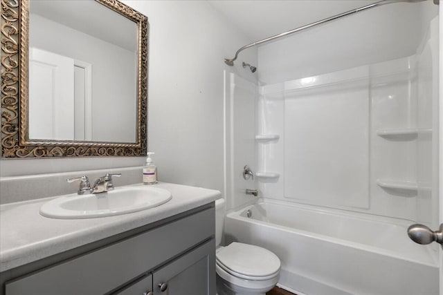 full bathroom with washtub / shower combination, toilet, and vanity