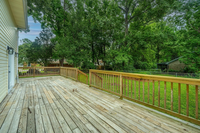 wooden deck with a yard