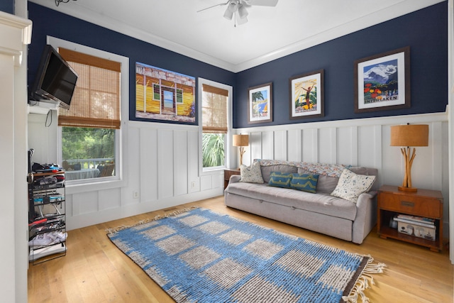 732 Gate Post Dr, Mount Pleasant, SC 29464 - living room with a ceiling fan, plenty of natural light, a decorative wall, wood finished floors, and wainscoting