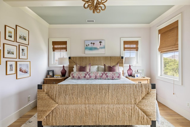 732 Gate Post Dr, Mount Pleasant, SC 29464 - bedroom featuring light wood finished floors and ornamental molding