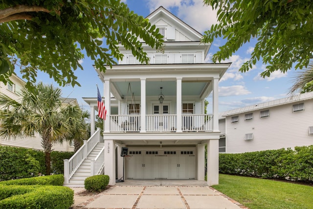 732 Gate Post Dr, Mount Pleasant, SC 29464 - coastal home featuring a porch, stairs, concrete driveway, an attached garage, and a front yard