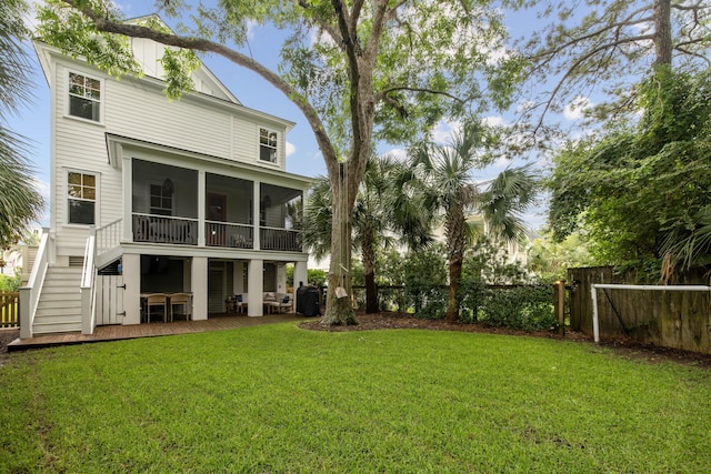732 Gate Post Dr, Mount Pleasant, SC 29464 - back of house with a fenced backyard, stairs, and a sunroom