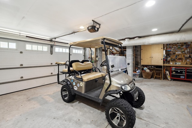 732 Gate Post Dr, Mount Pleasant, SC 29464 - garage featuring a garage door opener and a workshop area